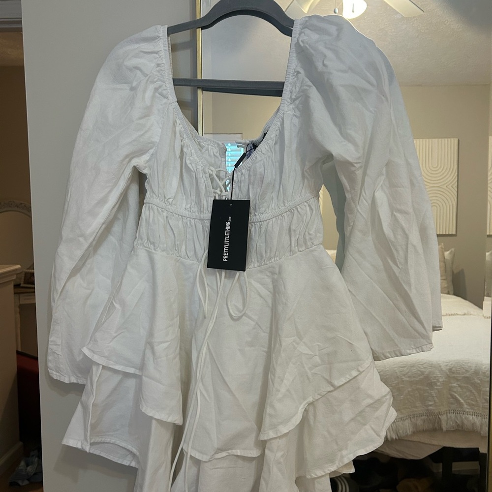 PrettyLittleThing white long sleeve romper!
